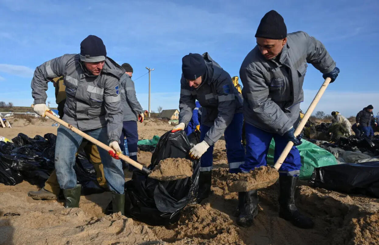 Volunteers help clean up oil on the beaches bordering the Black Sea